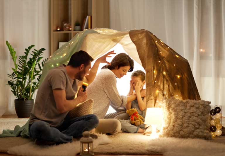 Telling ghost stories in a blanket fort