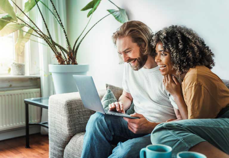 Couple looking at a laptop computer